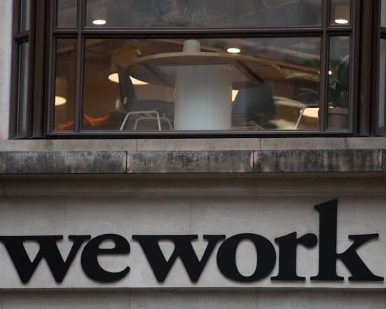 WEWORK PLANS TO LAYOFF 2,000 WORKERS
